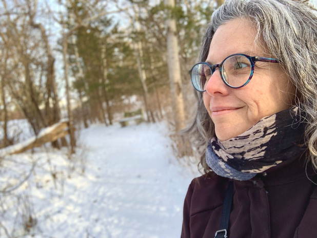 Mature woman profile in the snowy woods